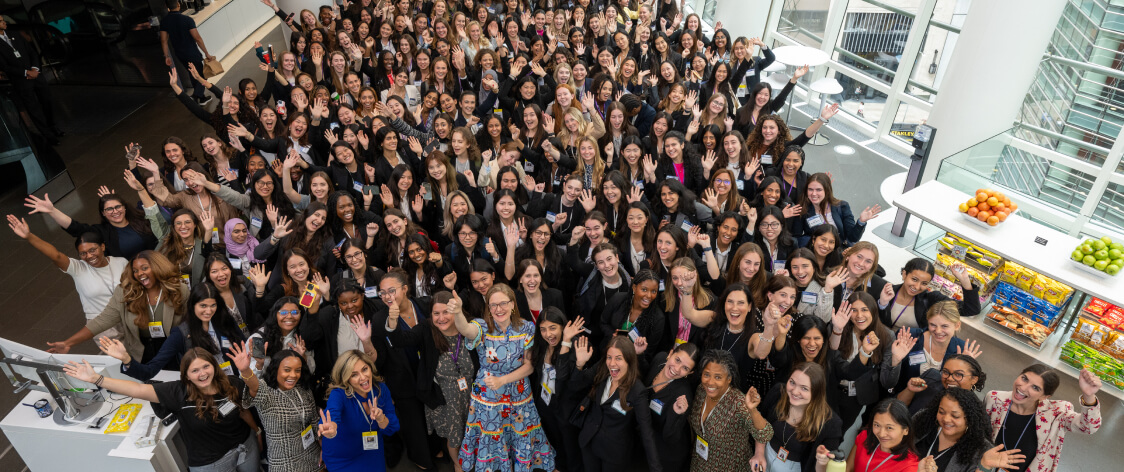 Members of Girls Who Invest organiztion at meetup posing for a group photo